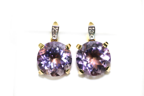 Золотые серьги с&nbsp;бриллиантом и&nbsp;аметистом