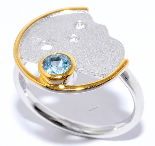 Серебряное кольцо с цирконием и топазом